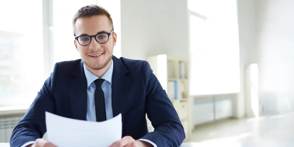 Chief Medical Officer reviewing healthcare documents in a corporate office, illustrating the benefits of specialized email outreach.