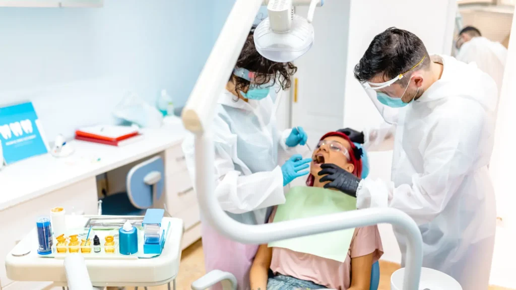 Team of endodontists and dental professionals collaborating on patient care strategy using comprehensive mailing list database