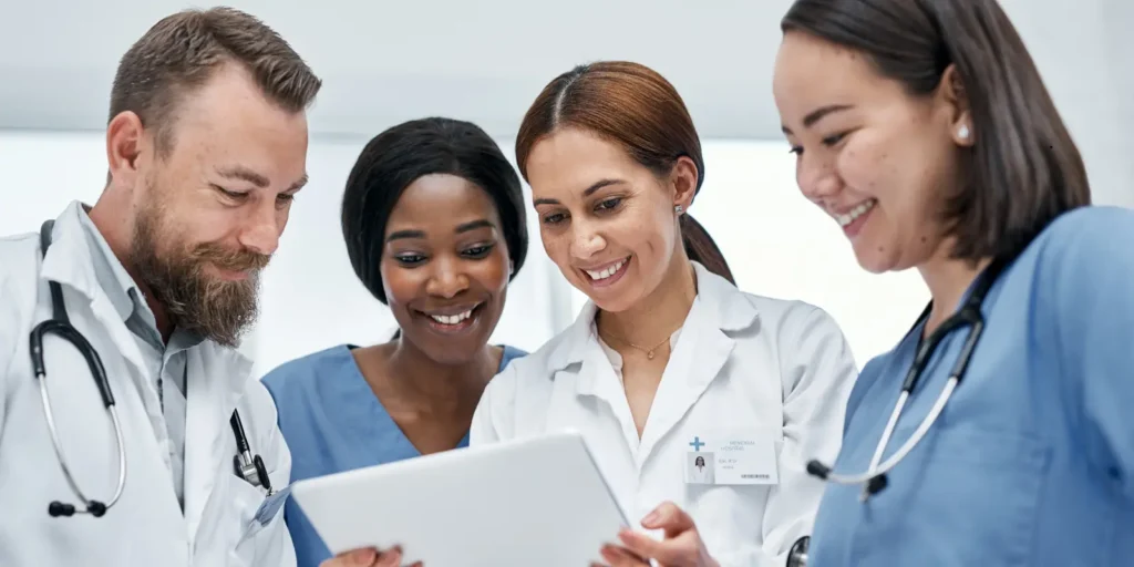 Group of doctors reviewing patient reports together — Comprehensive Hepatologist Email List