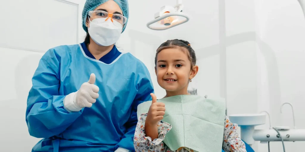 Pediatric dentist discussing dental care with child patient - Building a Pediatric Dentist Email List for healthcare marketing
