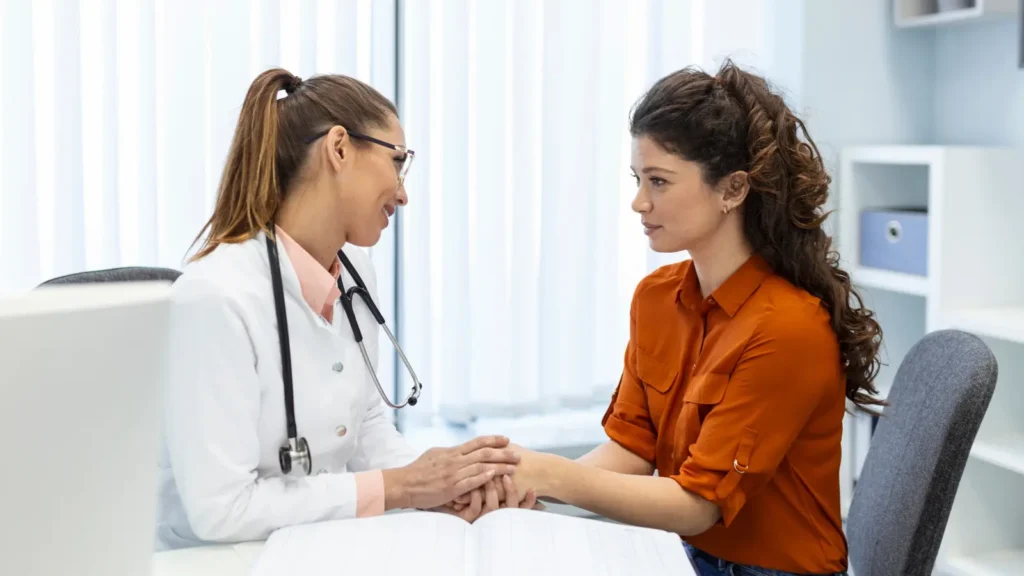 Healthcare professional consulting with patient about building an effective email list for medical marketing