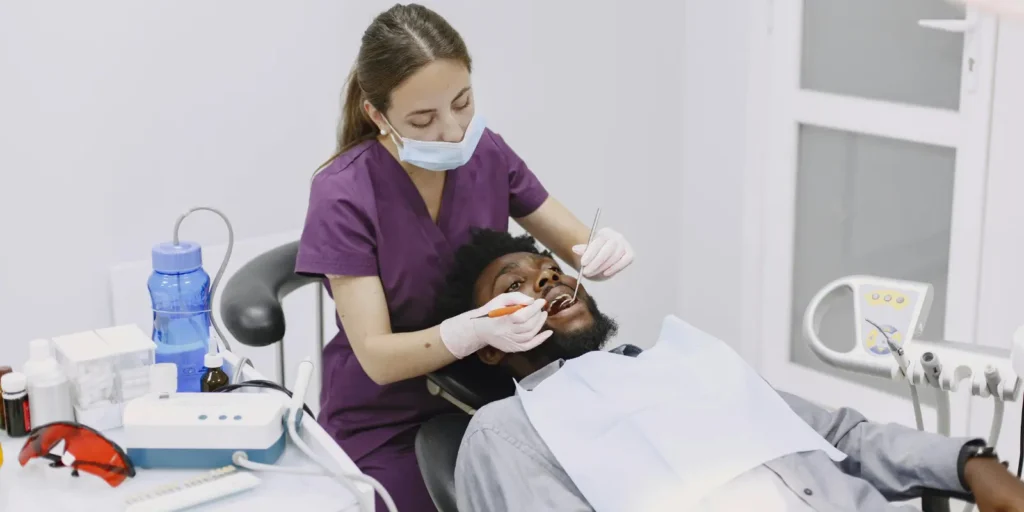 Female dental hygienist specialist working with dental equipment and materials - representing qualified professionals in dental hygiene email lists for B2B healthcare marketing campaigns and specialist recruitment