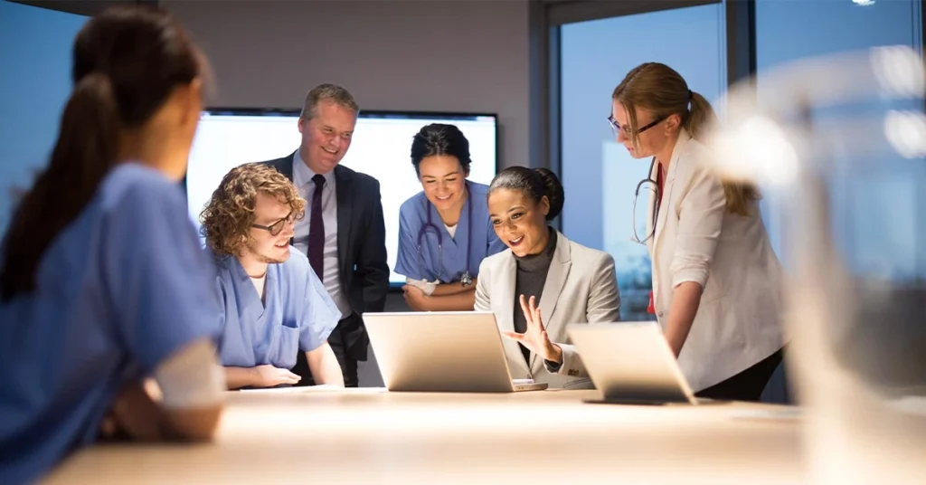 Marketing team discussing custom segmentation strategy for high performance email campaigns in a meeting room