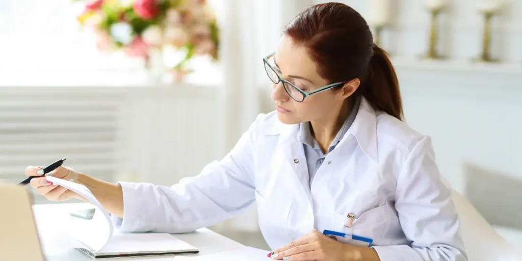 Healthcare professional working on laptop – accurate email lists in healthcare for targeted marketing