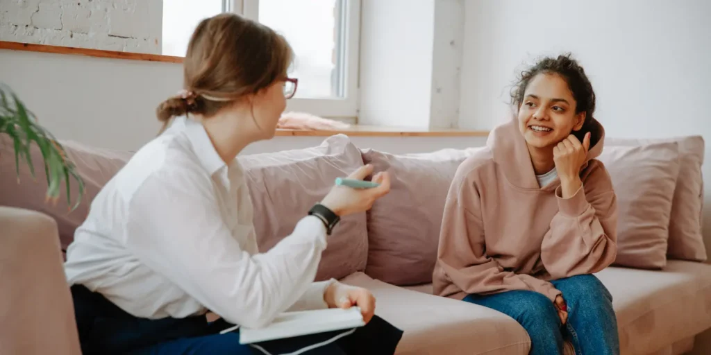 Physical therapist consulting patient during therapy session - Physical Therapist Email List