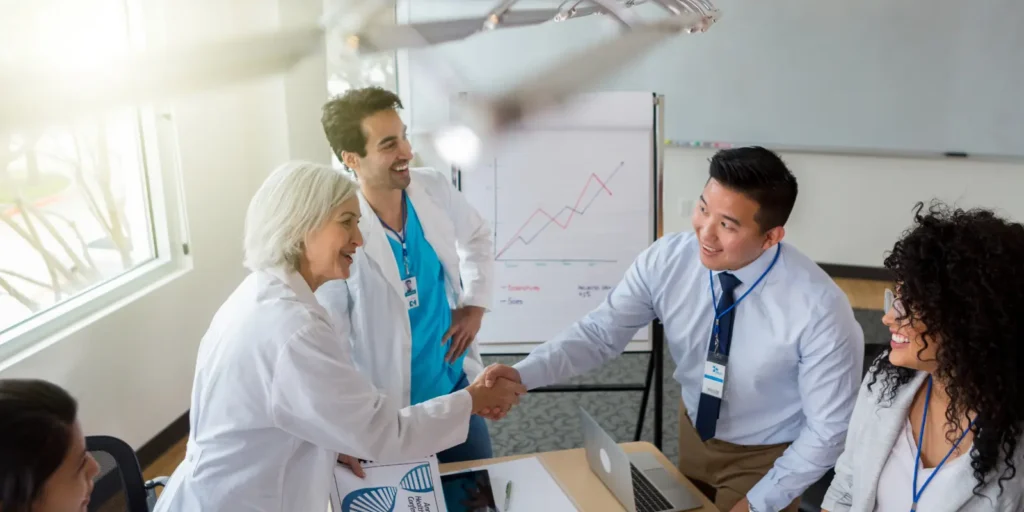 Healthcare professionals discussing pricing plans and database access options for hospital executives email list during professional consultation and healthcare B2B service meeting