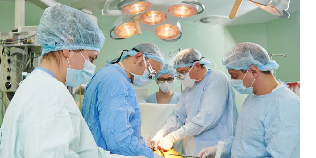 Surgical team collaborating in an operating room during a medical procedure.
