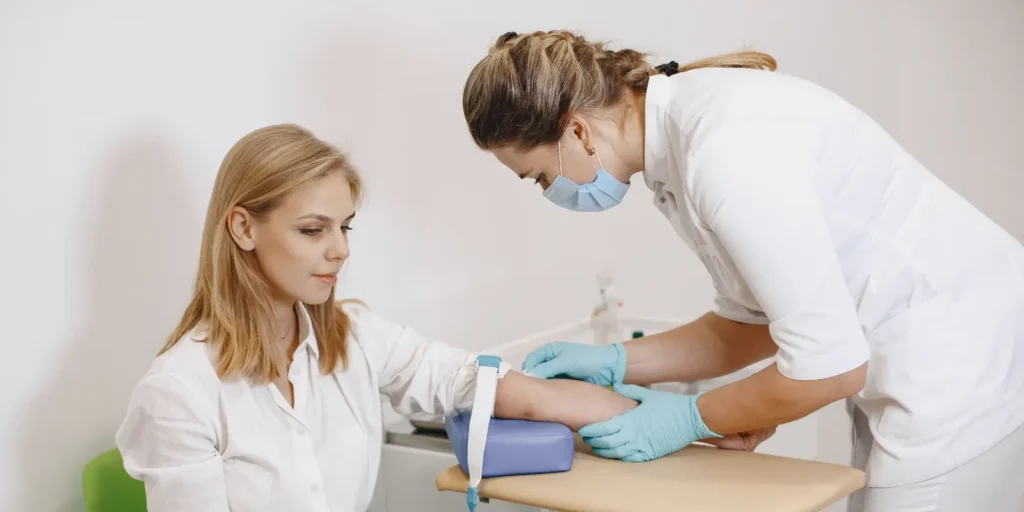 Medical professional explaining allergy and immunology procedures to a nurse