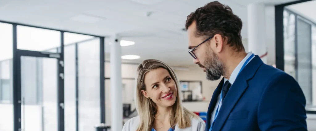 Business professionals discussing strategy – symbolic of navigating the medical director email landscape