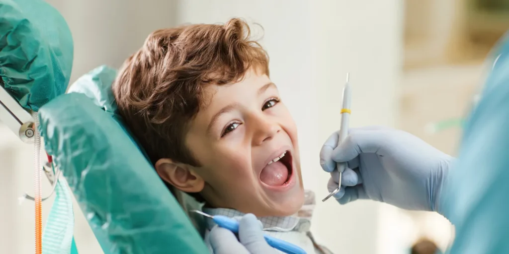 Dental professional working with a patient in a clinic, representing the practical use of an orthodontist contact list for healthcare outreach in the USA