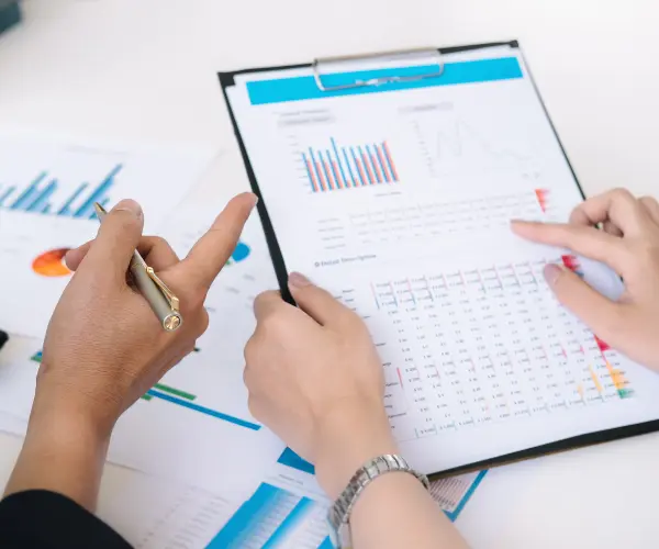 Data analysts reviewing email verification and deliverability reports for ambulatory care nurse mailing list Healthcare professionals analyzing ambulatory care nurse email database charts and metrics