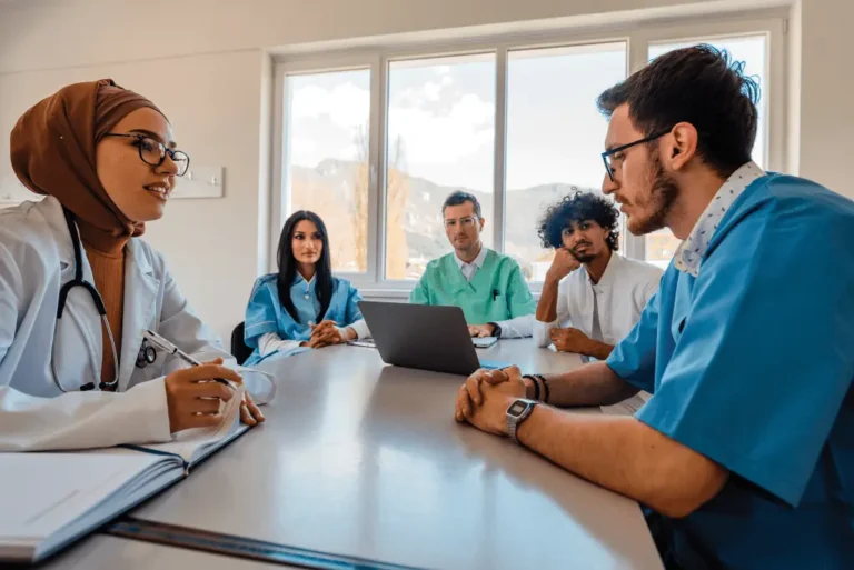 Chief nursing officers and hospital staff discussing the details included in our chief nursing officer email list during a conference meeting
